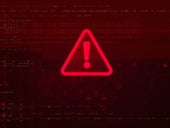 Red warning sign on red blurry background of code blocks.