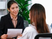 HR personnel interviewing an applicant.