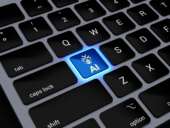 A black keyboard with the a key replaced by an AI key and backlit in blue.